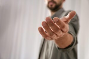 Man wth hand extended